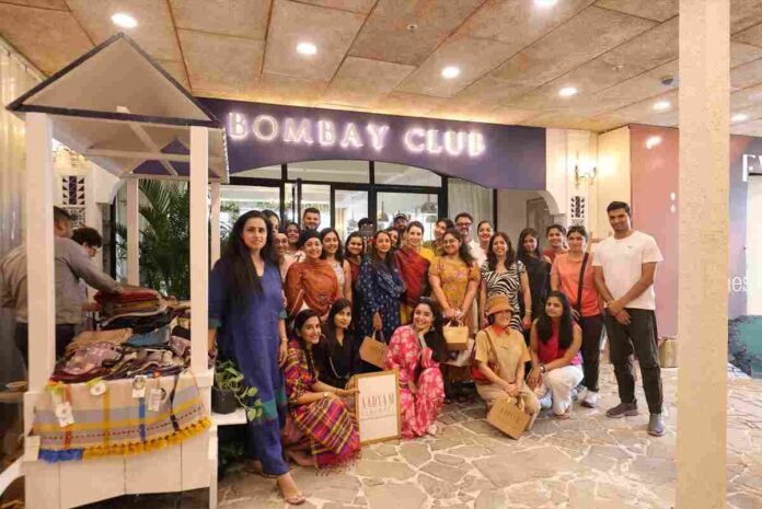 Chef Anahita Dhondy styling a dining table with Aadyam Handwoven artisanal textiles at Bombay Club
